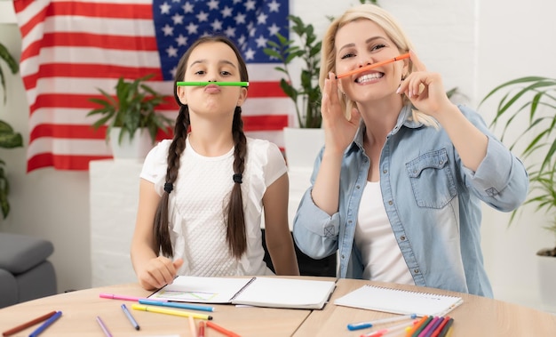 young girl learning english with teacher 493343 18762